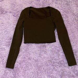 Dark brown crop top with a square neckline and long sleeves